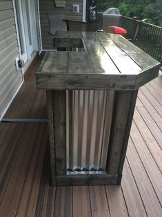 a wooden table sitting on top of a wooden deck