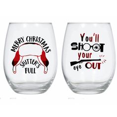 two wine glasses with christmas sayings on the front and back, one is red