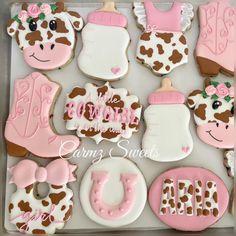 decorated baby shower cookies in a box with pink and brown designs on it's sides