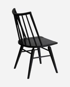 a black wooden chair against a white background with the seat up and one leg down