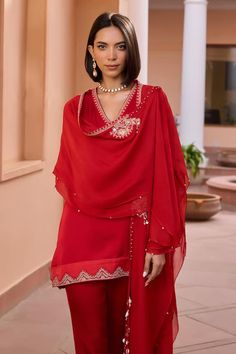 Red kurta with tilla, dori and brass beaded embroidery. Comes with pant and a cape. - Aza Fashions Festive Dabka Embellished Tops, Red Long Sleeve Kurta With Sheer Dupatta, Red Long Sleeve Set With Sheer Dupatta, Red Long Sleeve Sets With Sheer Dupatta, Red Blouse With Dupatta For Eid, Red Long Sleeve Palazzo Set For Designer Wear, Red Traditional Blouse With Sheer Dupatta, Red Long Sleeve Palazzo Set With Dabka Details, Red Long Sleeve Tops For Eid