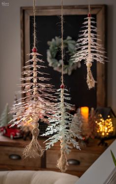 christmas decorations hanging from the ceiling in a living room