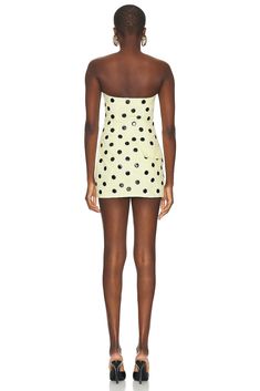 Find AREA Polka Dot Strapless Mini Dress In Yellow on Editorialist. AREA Polka Dot Strapless Mini Dress in Yellow Self: 100% cotton Lining: 100% viscose. Made in China. Dry clean only. Unlined. Front zipper closure. 4-pocket styling. Rigid denim fabric with glossy polka dots. ARFE-WD138. 2401D16332. About the designer: AREA is a fashion and accessories label specializing in quality craftsmanship, textile development, and innovative embellishment. Founded by designers Beckett Fogg and Piotrek Pansczczyk in downtown NYC, AREA’s signature style is multi-faceted: witty, inherently glam, playfully decadent, and injected with a pop energy. The brand shares its name and spirit with the iconic 80s Manhattan nightclub, known for its fusion of art and performance in conceptually-themed events. Since Mod Mini Dress, Cream Yellow, Yellow Cream, Strapless Mini Dress, Cream Dress, Polka Dot Dress, Denim Fabric, Signature Style, Night Club