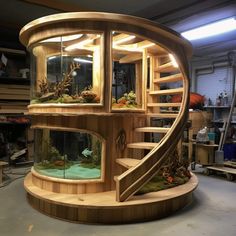 a fish tank in the shape of a spiral staircase