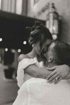 black and white photograph of a couple embracing each other