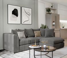 a living room filled with lots of furniture next to a dining table and kitchen area