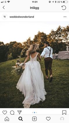 a bride and groom running through the grass