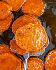 cooked sweet potatoes in oil being stirred with a spatula to make them look like they have been cooked