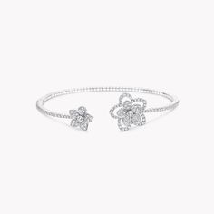 Two contrasting diamond flowers blossom side by side upon our Wild Flower bracelet, distinct yet complementary. Bursting with life, the flowers are connected by a delicate, beautifully articulated row of diamonds and realised with a wild touch that is unique down to every petal. Updating the traditional English Garden with carefree charm and a contemporary spirit, four varieties of flower flourish in rare abundance in our Wild Flower garden, inspiring you to mix, match and make everyday diamonds Graff Bracelet, Large Diamond Stud Earrings, Traditional English Garden, Wild Flower Garden, Large Diamond Rings, Rare Diamonds, Bangle Diamond, Graff Diamonds, Flower Diamond Ring