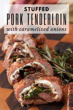 stuffed pork tenderloin with caramelized onions and herbs on a cutting board