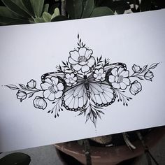 a drawing of a butterfly with flowers on it