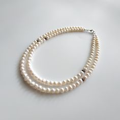 "< White and blue pearl necklace > It is well known fact, that pearls are the best accessory for weddings. But it is not only bridal jewelry. As Jackie Keneddy once said \"Pearls are always appropriate\". We can not disagree with this. Pearl jewelry is same perfect for special occasions and daily life. There is nothing more elegent and feminine like pearls. Every woman should have such a perfect beauty in her jewelry box. > Necklace's length- 39 cm (15,3 in) > Necklace's weight - 50 White Double Strand Pearl Necklaces, Double Strand Pearl Necklaces With Gemstone Beads, Wedding Pearl Necklaces With Natural Stones, Wedding Necklaces With Natural Stones And Pearls, Double Strand Pearl Necklace With Gemstone Beads, White Double Strand Pearl Drop Necklaces, Anniversary Pearl White Double Strand Necklace, Wedding Necklace With Natural Round Stone Beads, Wedding Necklace With Round Natural Stones