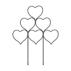 four heart shaped cake toppers on a stick