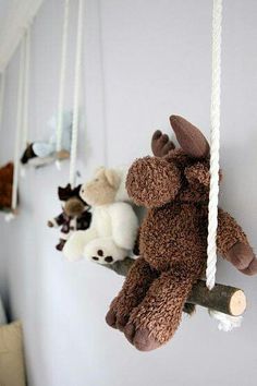 stuffed animals are hanging on the wall