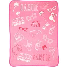 a pink towel with various items on it and the words barbie written in white ink