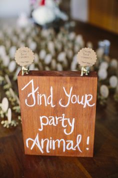 a wooden sign that says find your party animal