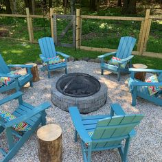 a fire pit surrounded by chairs and logs