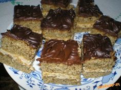 nine pieces of cake on a blue and white plate