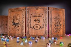 several wooden dice boards with different designs on them