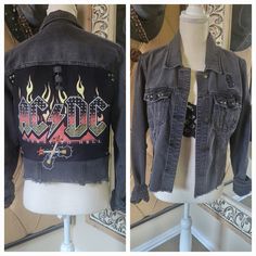 the back and front views of a jean jacket with flames on it, sitting on a mannequin