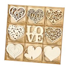 wooden cutouts in a box with the words love and hearts written on each one