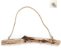 a piece of driftwood hanging from a rope