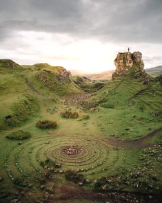 an aerial view of a grassy area with spiral designs in the grass