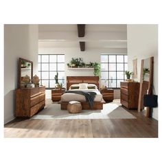 a bedroom scene with focus on the bed, dressers and other furniture in the room