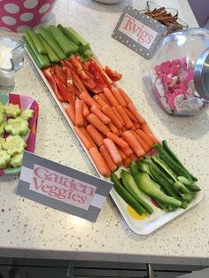 carrots, celery and cucumbers are arranged on the counter top