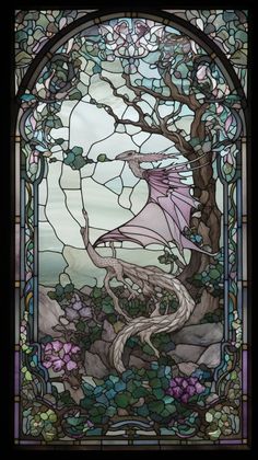 a stained glass window with a dragon on it's back and trees in the background