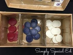 two boxes filled with different colored buttons on top of a black table next to each other