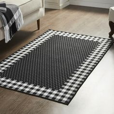 a black and white checkered rug in a living room