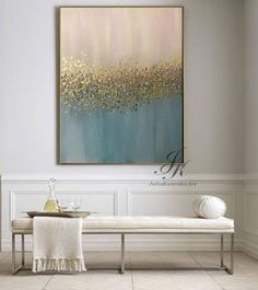 a painting hanging on the wall above a bench in a room with white walls and tile flooring