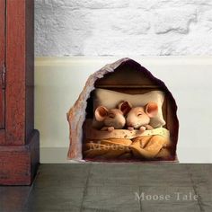 two little mouses sitting in a small cave