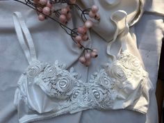 Dainty, lightweight, elastic satin bra from the 1970's-80's with a luxurious thick satiny shiney lace and butterflies Xs-s Eur 70-75B UK 32-34B Excellent condition Faded label inside Feminine Wedding Bra With Delicate Lace, Elegant Summer Bra With Lace Closure, Cream Lace Underwire Bra, Feminine Cream Lace Bra, Lace Bodice Bra For Weddings, Cream Lace Bra With Lace Trim, Fitted Lace Trim Bra For Wedding, Fitted Wedding Bra With Lace Closure, Elegant Lace Bra For Wedding Night