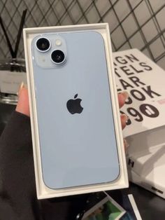 someone is holding up an iphone case with the camera on it's back side