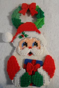 a christmas ornament with a santa clause on it