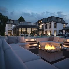 a fire pit sitting on top of a white couch