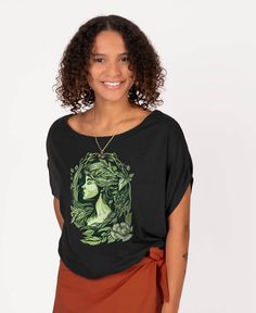 Take time to appreciate the beauty and nurturing love of our Mother Nature when wearing this Mother Nature Bamboo Viscose Dolman Top. A flattering top to wear off the shoulder, featuring a wide scoop neck and deep armholes. Print reveals a beautiful depiction of the goddess herself - mother nature, on breathable and cooling fabric. This earth mother tee hits right above the hips at the low waist. Black. Beautiful Boho Dresses, Sixties Dress, Organic Cotton Leggings, Earth Mother, Cotton Bralette, Boho Boutique, Flattering Tops, Maxi Skirt Dress, Dolman Top