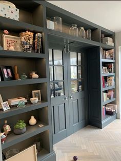 an empty room with many bookshelves in it