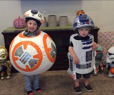 two children dressed up as bbg and r2 - d2 for halloween costumes