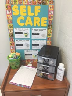 a wooden desk topped with drawers and a sign that says self care next to it