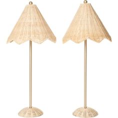 two lamps that are sitting next to each other on a white background and one is made out of wicker