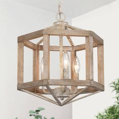 This Farmhouse Chandelier 3-Light Rusty White Weathered Wood Cage Candlestick Globe Chandelier Dining Room Ceiling Light is crafted of sturdy metal with antique texture offwhite finish and solid weathered wood with tiny dots which brings dynamic natural aesthetic and strong senes of historical sense. The vintage candlestick bulbs(not included) on the caldle holders generate soft light through the unique hexagon-designed wood and metal frame, brings a hint of geometric rustic style to your lovely Globe Chandelier Dining Room, Wood Chandelier Rustic, Candlestick Chandelier, French Country Chandelier, Dining Room Ceiling Lights, Country Chandelier, Cage Chandelier, Cage Pendant Light, Dining Room Ceiling