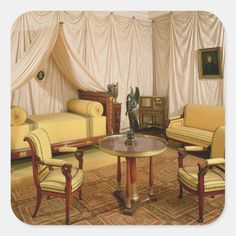 a living room with two couches, chairs and a table in front of a curtained wall