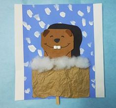 a paper cut out of a dog in a box with clouds and bottles on it