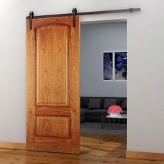 an open wooden door in a living room