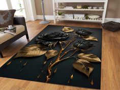 a black rug with gold leaves on it in front of a couch and coffee table