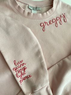 Grandma's favorite names hand stitched on the sleeve of our cozy fleece lined sweatshirts.    Sweatshirts are Unisex sizing and run true to size.  I suggest sizing up for a more oversized fit. 70/30 cotton/polyester 3-End fleece, ring spun cotton  Returns and Exchanges: I do not accept returns on personalized pieces but will be happy to discuss any issues via messages. Thanks for visiting Sweet Olive Street! Please check us out on Instagram for more behind the scenes @sweetolivestreet Long Sleeve Fleece Top With Letter Embroidery, Fleece Top With Letter Embroidery And Long Sleeves, Cozy Long Sleeve Sweatshirt With Embroidered Logo, Cozy Embroidered Long Sleeve Sweatshirt, Fall Fleece Sweater With Embroidered Text, Cozy Long Sleeve Sweatshirt With Letter Embroidery, Fall Embroidered Text Fleece Sweater, Pink Long Sleeve Sweatshirt With Custom Embroidery, Pink Long Sleeve Sweatshirt With Embroidered Text