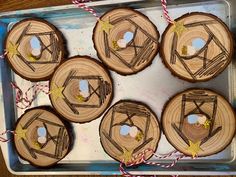 four wooden slices are arranged in the shape of stars and arrows on top of each other